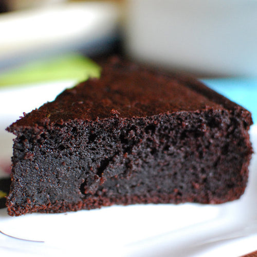 Slice of rich, dark, gluten free chocolate cake